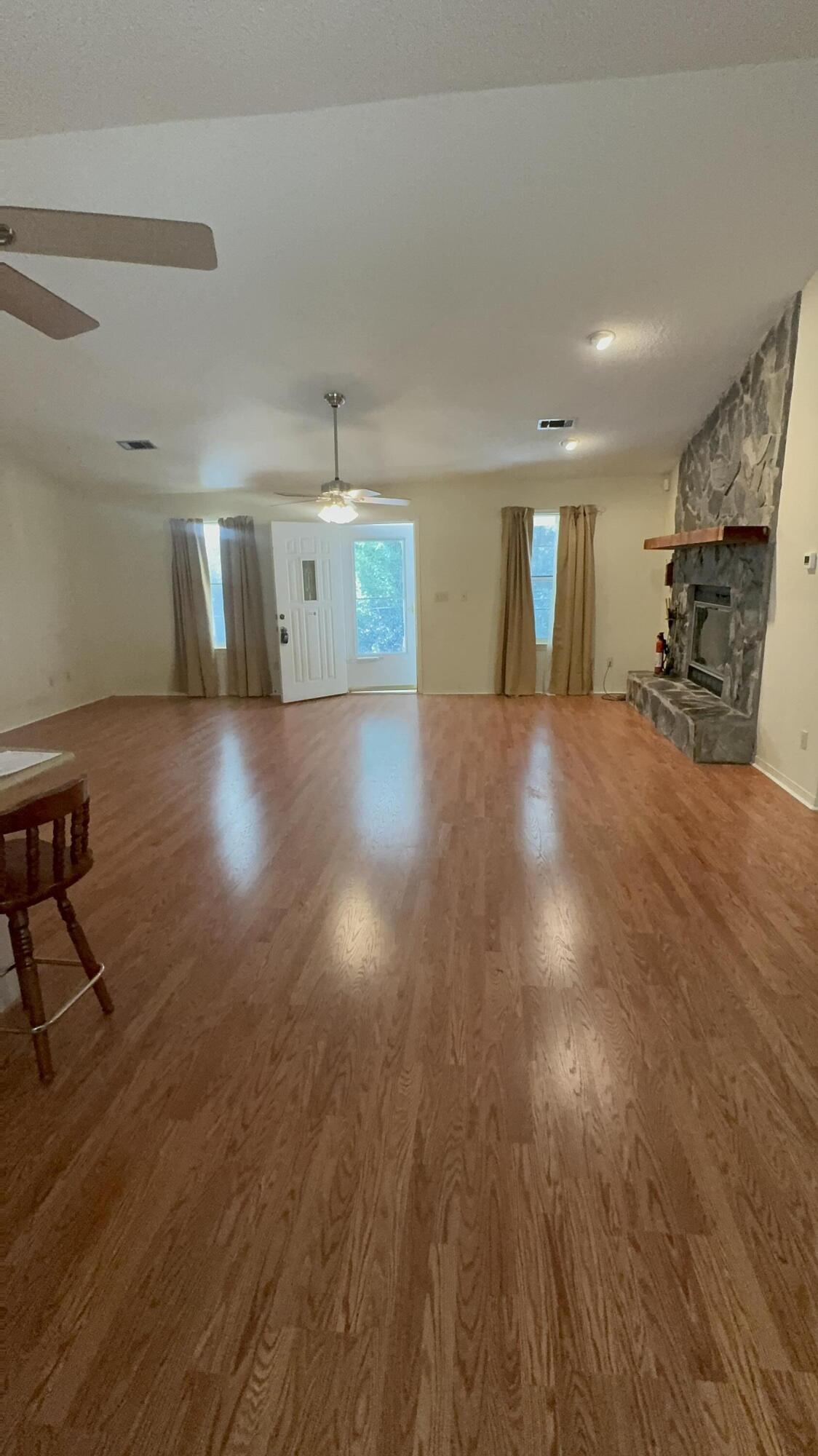 5957 Ridgecrest Road Crestview, FL 32539 - Photo 8 of 56 a view of a livingroom with furniture and wooden floor
