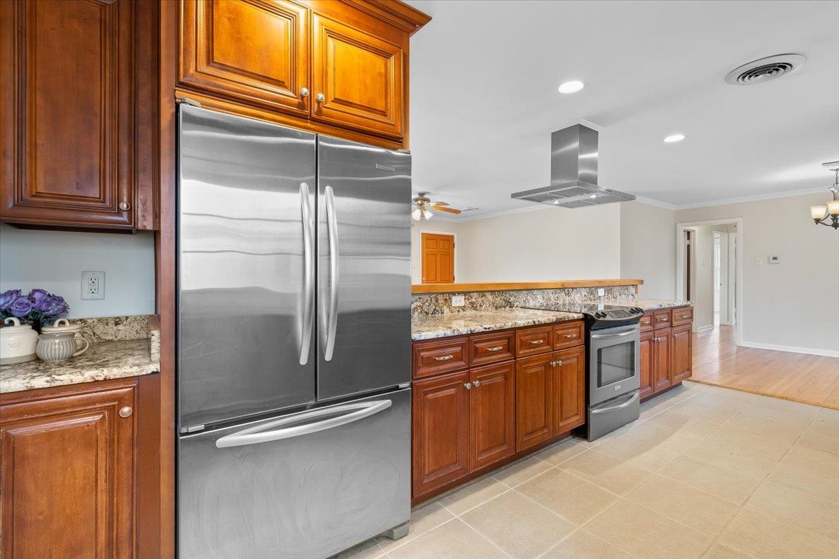 1556 Hayne Road Memphis, TN 38119 - Photo 11 of 27 a kitchen with stainless steel appliances granite countertop a refrigerator and a stove