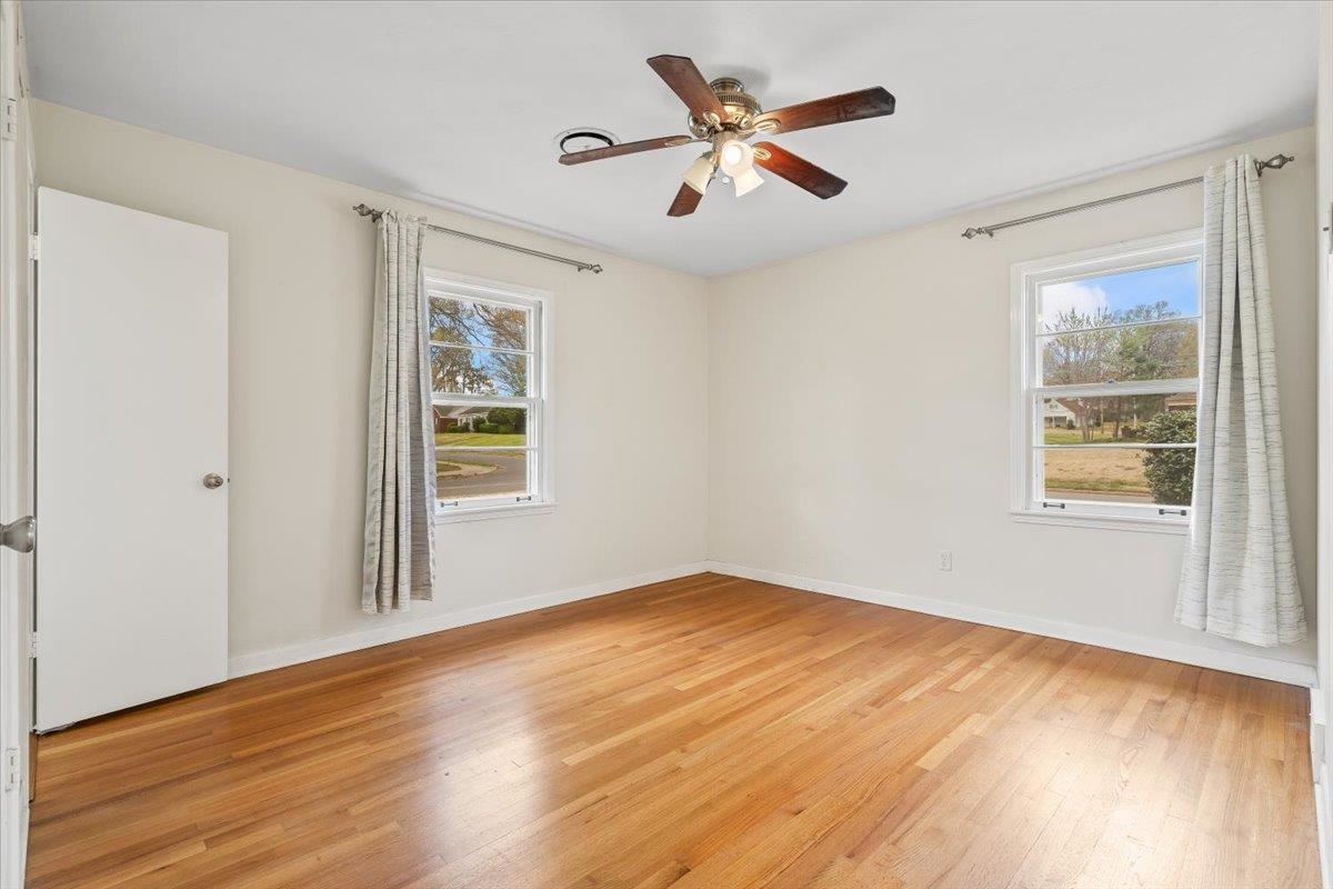 1556 Hayne Road Memphis, TN 38119 - Photo 14 of 27 a view of empty room with wooden floor and fan