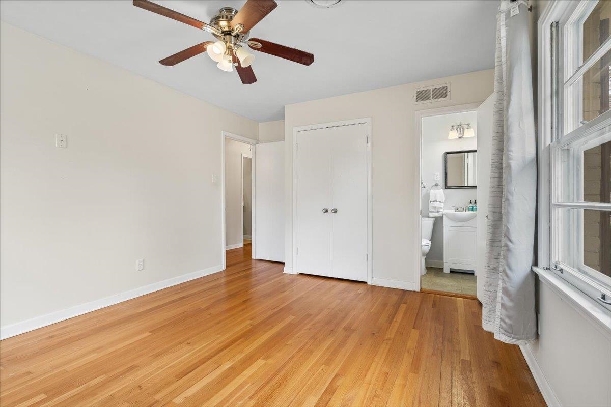1556 Hayne Road Memphis, TN 38119 - Photo 15 of 27 a view of empty room with wooden floor and fan
