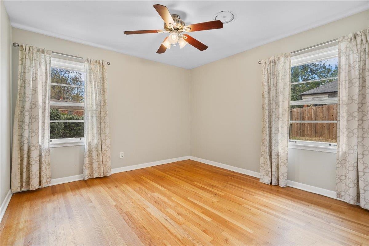 1556 Hayne Road Memphis, TN 38119 - Photo 18 of 27 wooden floor in an empty room with a window