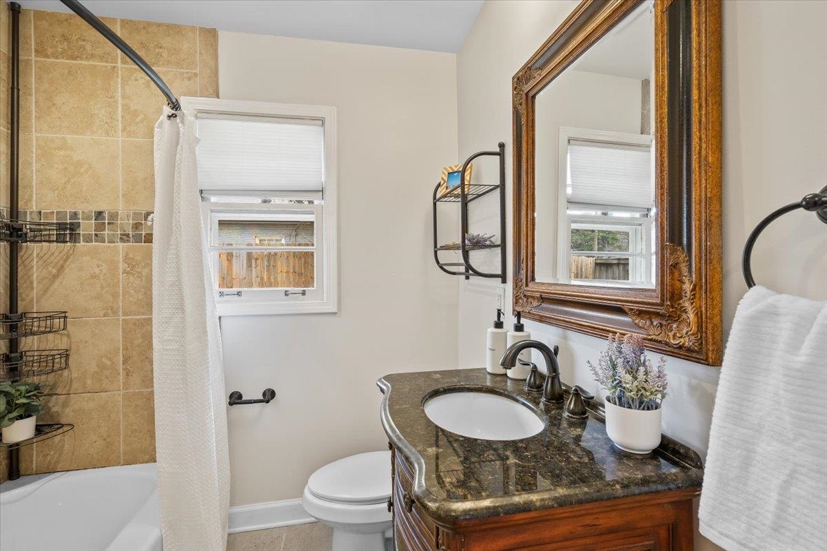 1556 Hayne Road Memphis, TN 38119 - Photo 19 of 27 a bathroom with a sink toilet and shower
