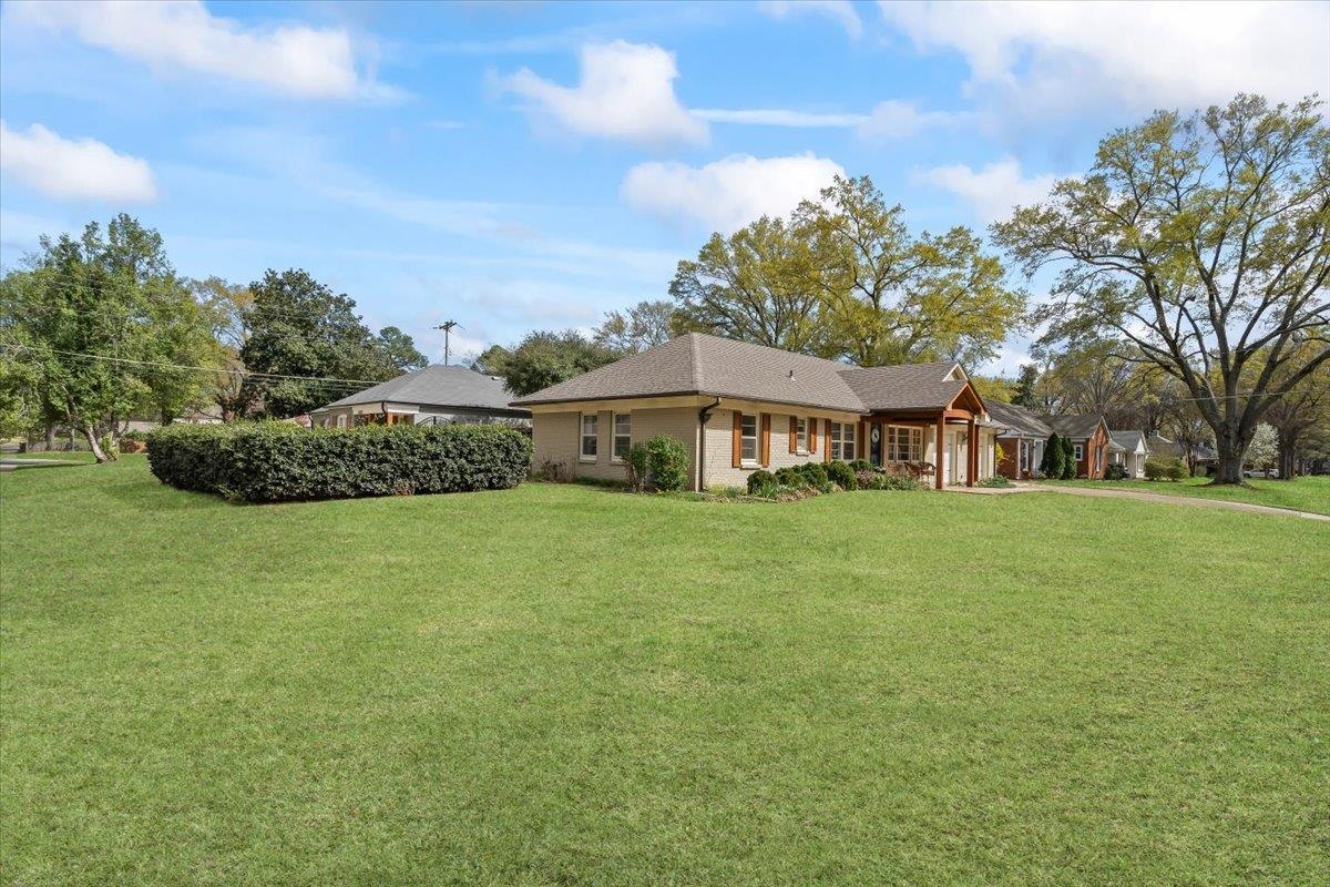 1556 Hayne Road Memphis, TN 38119 - Photo 26 of 27 a front view of a house with a garden