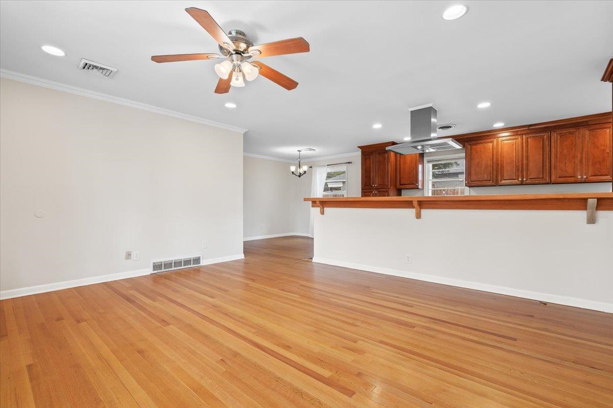 1556 Hayne Road Memphis, TN 38119 - Photo 5 of 27 a view of a kitchen with a sink and cabinet with wooden floor