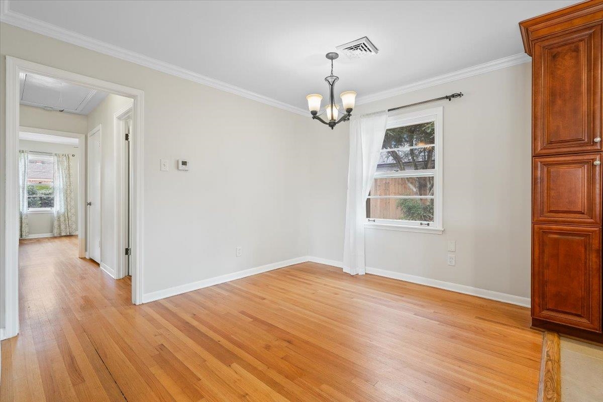 1556 Hayne Road Memphis, TN 38119 - Photo 7 of 27 a view of empty room with wooden floor and fan