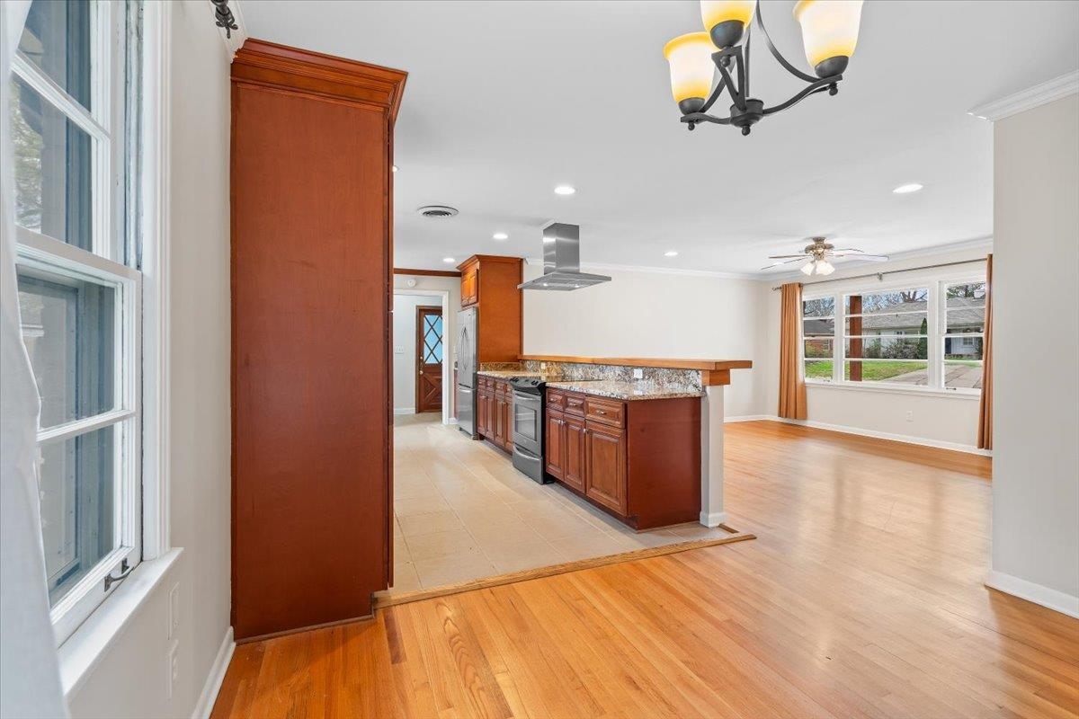 1556 Hayne Road Memphis, TN 38119 - Photo 8 of 27 a view of a kitchen with a sink and wooden floor