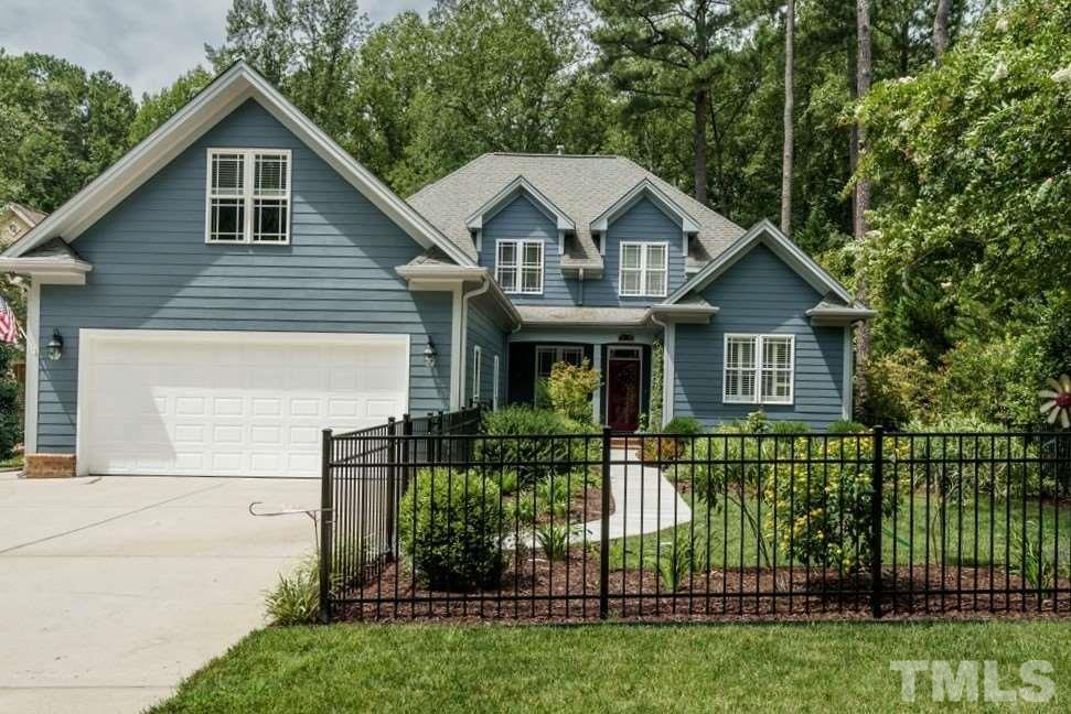 8119 Dreamy Way Raleigh, NC 27613 - Photo 1 of 30 a front view of a house with a yard
