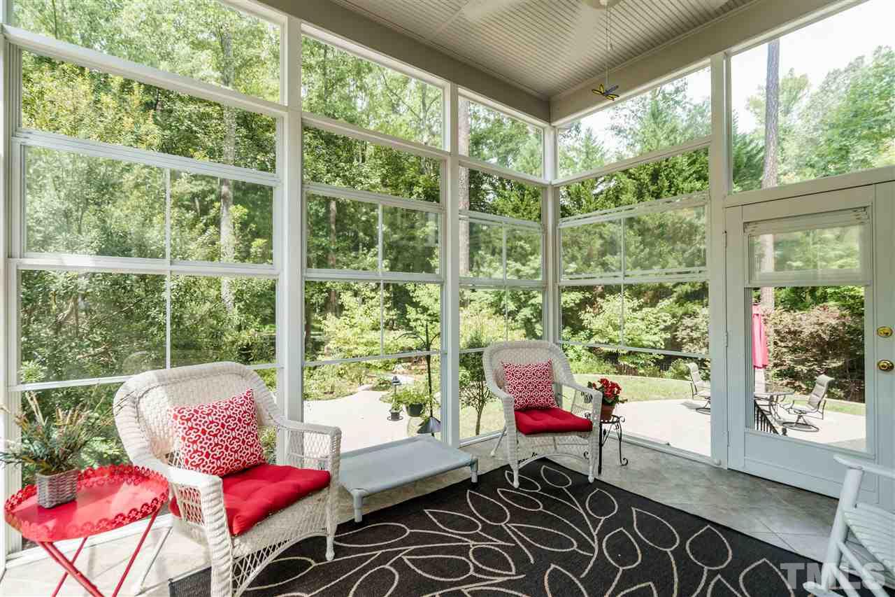 8119 Dreamy Way Raleigh, NC 27613 - Photo 11 of 30 a living room with furniture and a window
