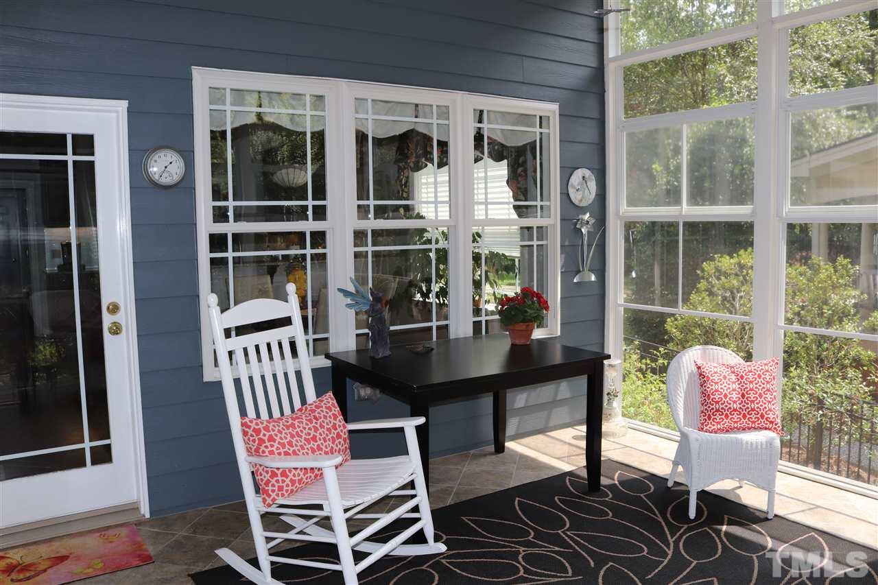 8119 Dreamy Way Raleigh, NC 27613 - Photo 12 of 30 a view of a outdoor dining space with a table and chairs