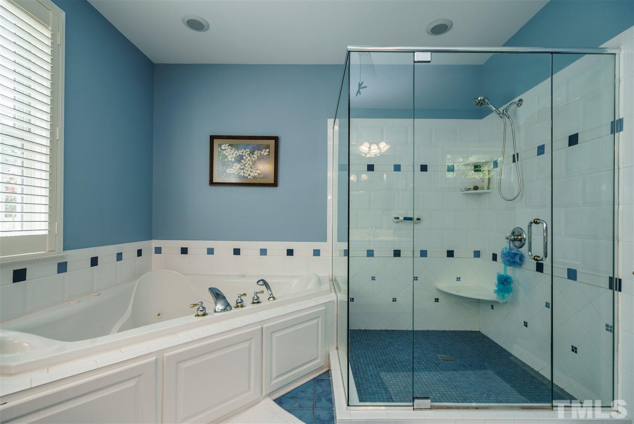 8119 Dreamy Way Raleigh, NC 27613 - Photo 20 of 30 a bathroom with a bathtub and a shower