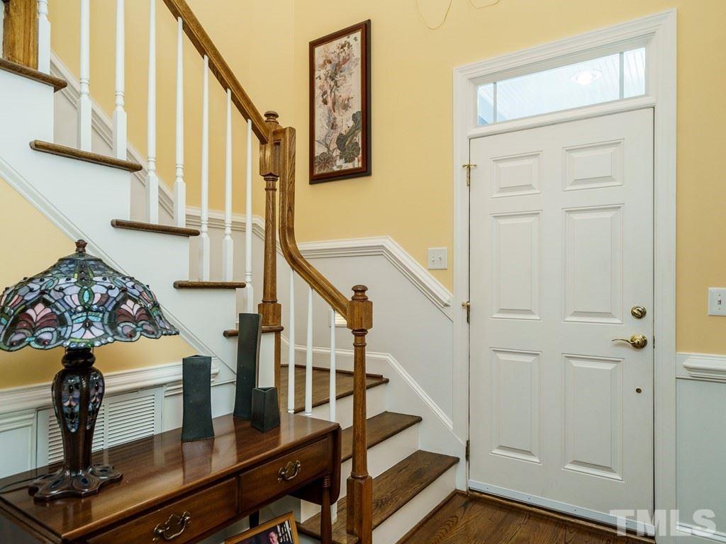 8119 Dreamy Way Raleigh, NC 27613 - Photo 3 of 30 a view of entryway with wooden floor and stairs