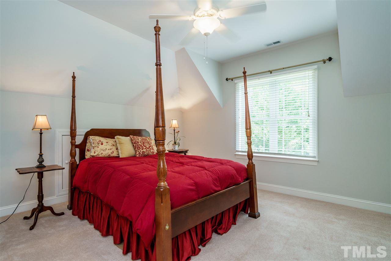 8119 Dreamy Way Raleigh, NC 27613 - Photo 21 of 30 a bedroom with bed and a window