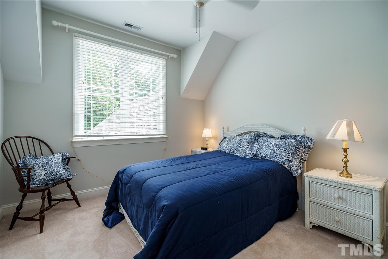 8119 Dreamy Way Raleigh, NC 27613 - Photo 23 of 30 a bedroom with a bed and a window