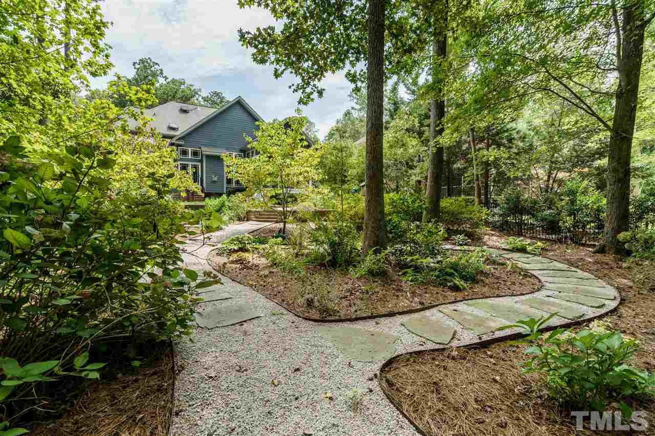 8119 Dreamy Way Raleigh, NC 27613 - Photo 27 of 30 a view of a garden with a tree