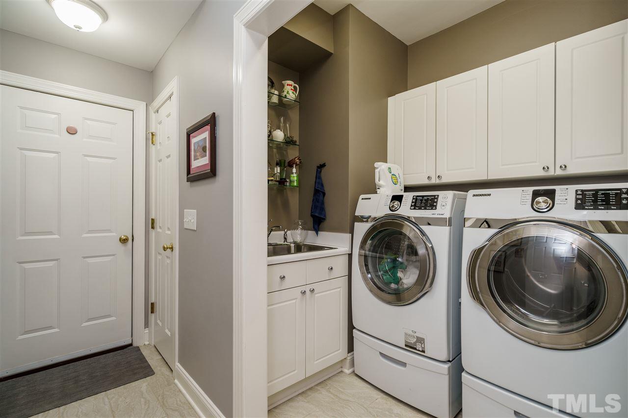 8119 Dreamy Way Raleigh, NC 27613 - Photo 29 of 30 a utility room with sink dryer and washer
