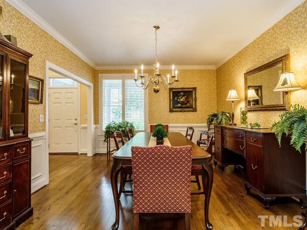 8119 Dreamy Way Raleigh, NC 27613 - Photo 5 of 30 a view of a dining room with furniture window and wooden floor