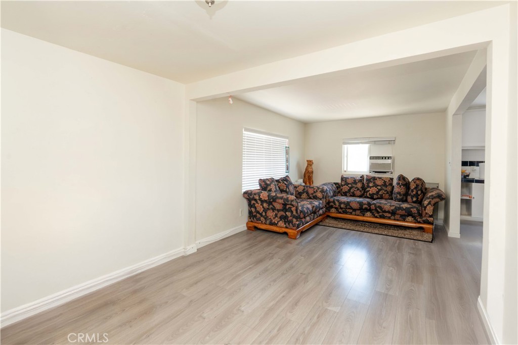 285 West 9th Street San Pedro, CA 90731 - Photo 13 of 22 a living room with furniture and wooden floor