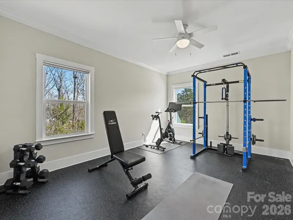 a view of walk in closet with clothes