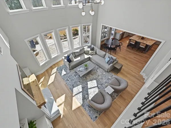 a view of a workspace with furniture and wooden floor