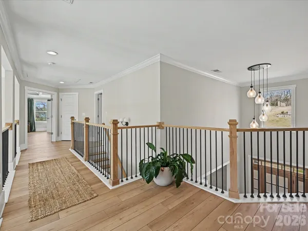 a bedroom with furniture and a large window