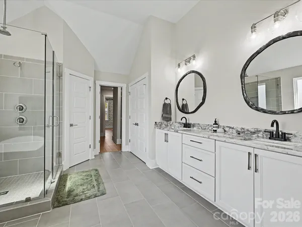 a view of a patio with a dining table and chairs with wooden floor
