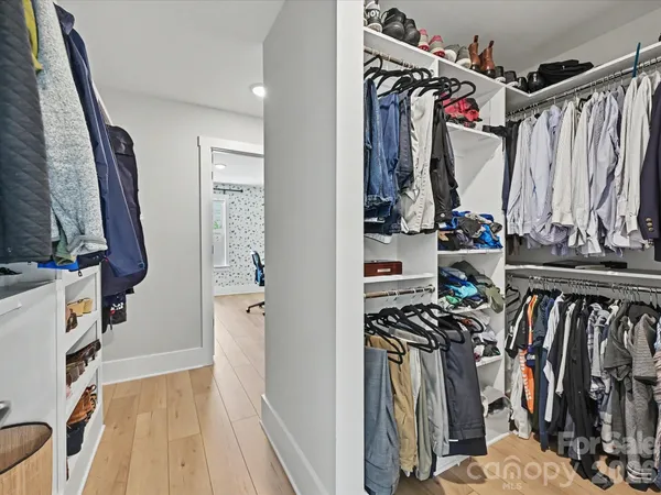 a group of people sitting in a yard with swimming pool