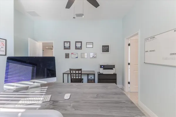 a view of a livingroom with furniture and an empty room
