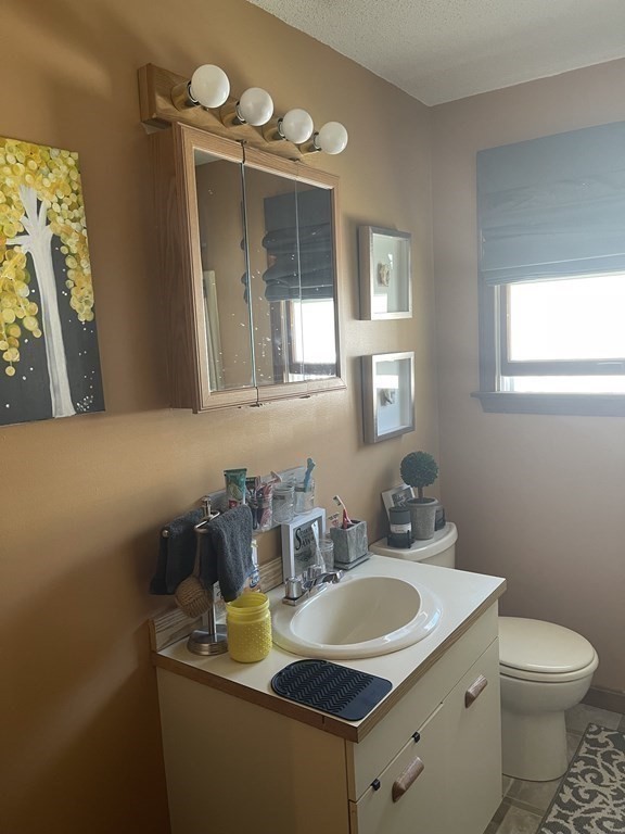 178 3rd Street, Unit 178 Lowell, MA 01850 - Photo 13 of 18 a bathroom with a sink and a mirror