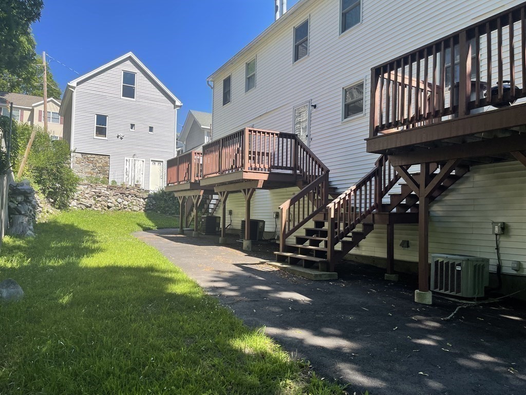 178 3rd Street, Unit 178 Lowell, MA 01850 - Photo 18 of 18 a view of a house with a yard