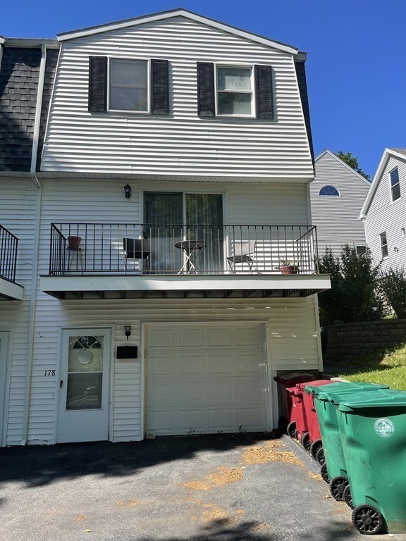 178 3rd Street, Unit 178 Lowell, MA 01850 - Photo 2 of 18 a front view of a house with a yard