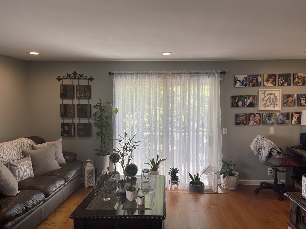 178 3rd Street, Unit 178 Lowell, MA 01850 - Photo 4 of 18 a living room with furniture and a window