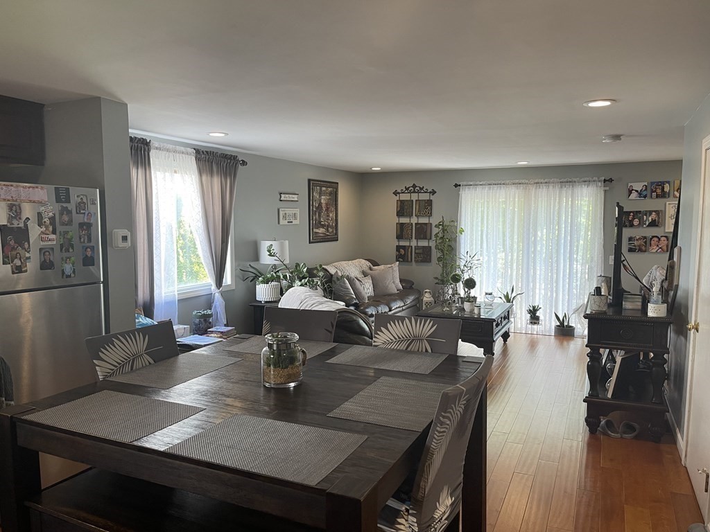 178 3rd Street, Unit 178 Lowell, MA 01850 - Photo 6 of 18 a view of a dining room with furniture window and wooden floor