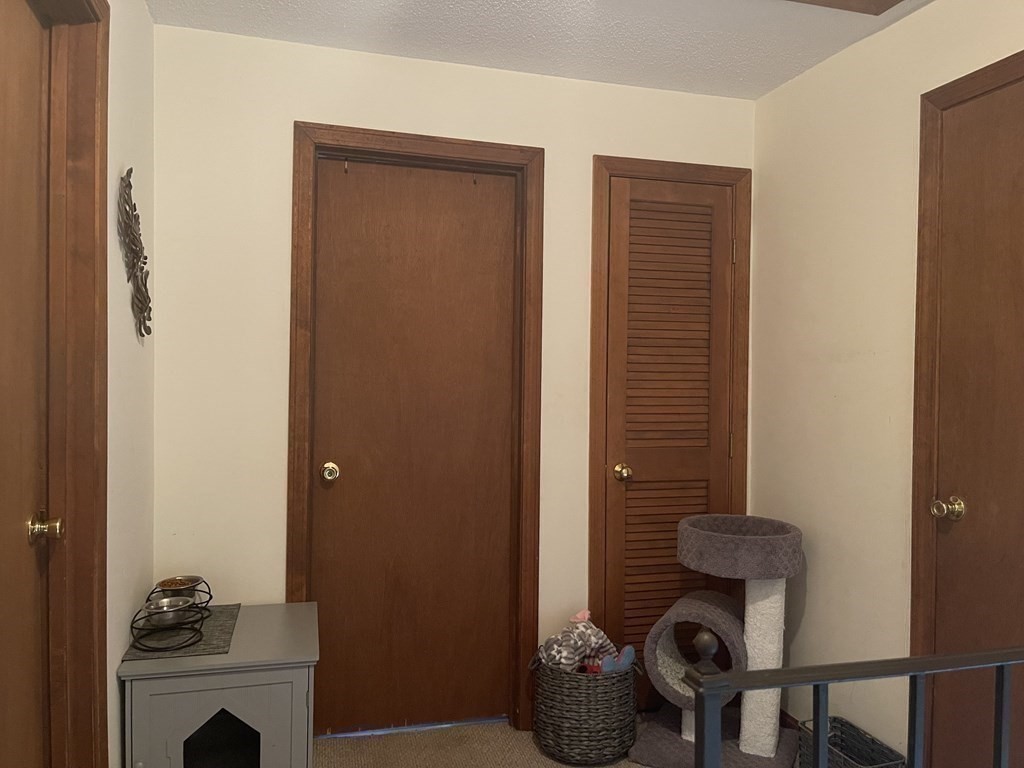 178 3rd Street, Unit 178 Lowell, MA 01850 - Photo 10 of 18 a room with furniture and a fireplace