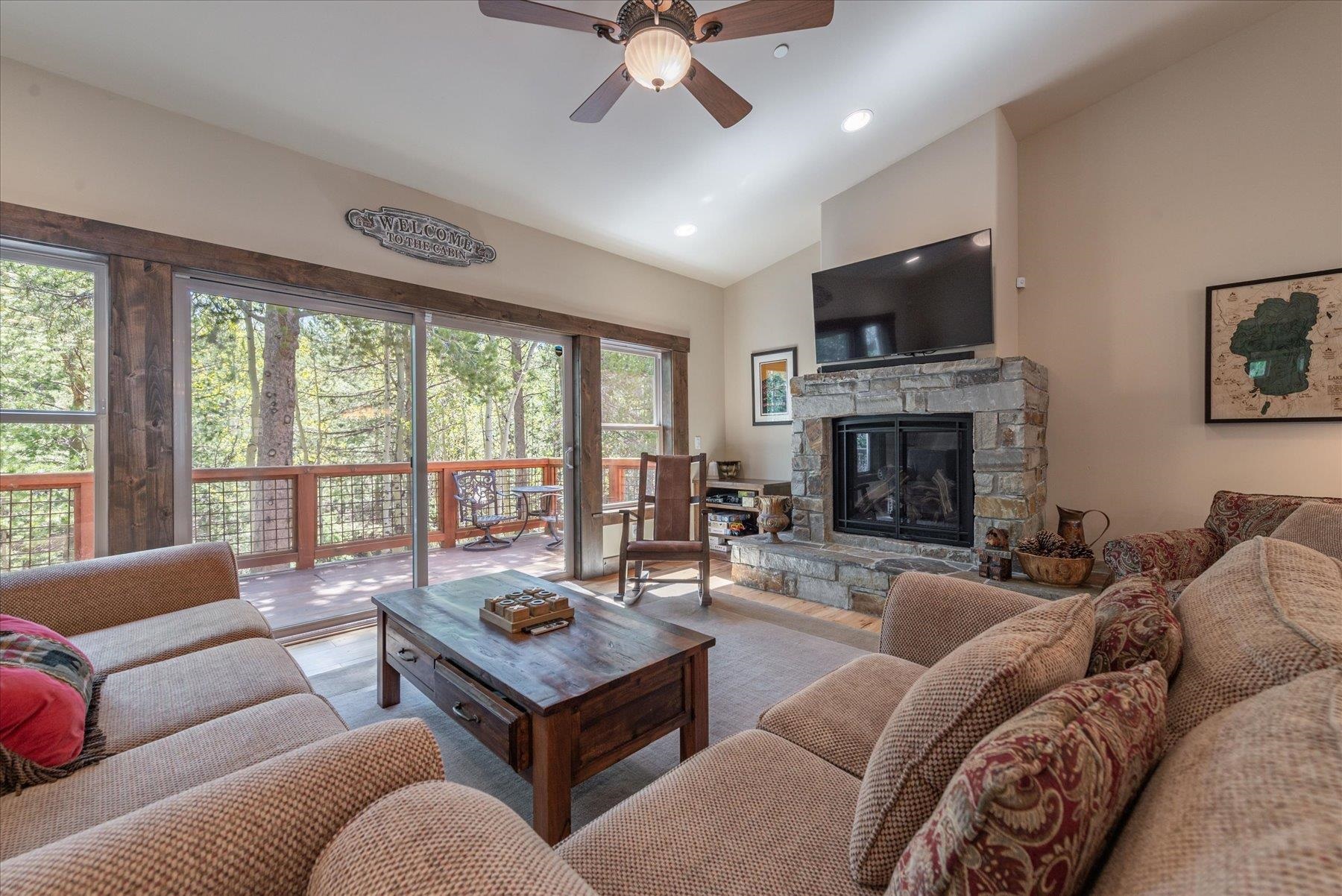 14475 Alder Creek Road Truckee, CA 96161 - Photo 11 of 21 a living room with furniture fireplace and a flat screen tv