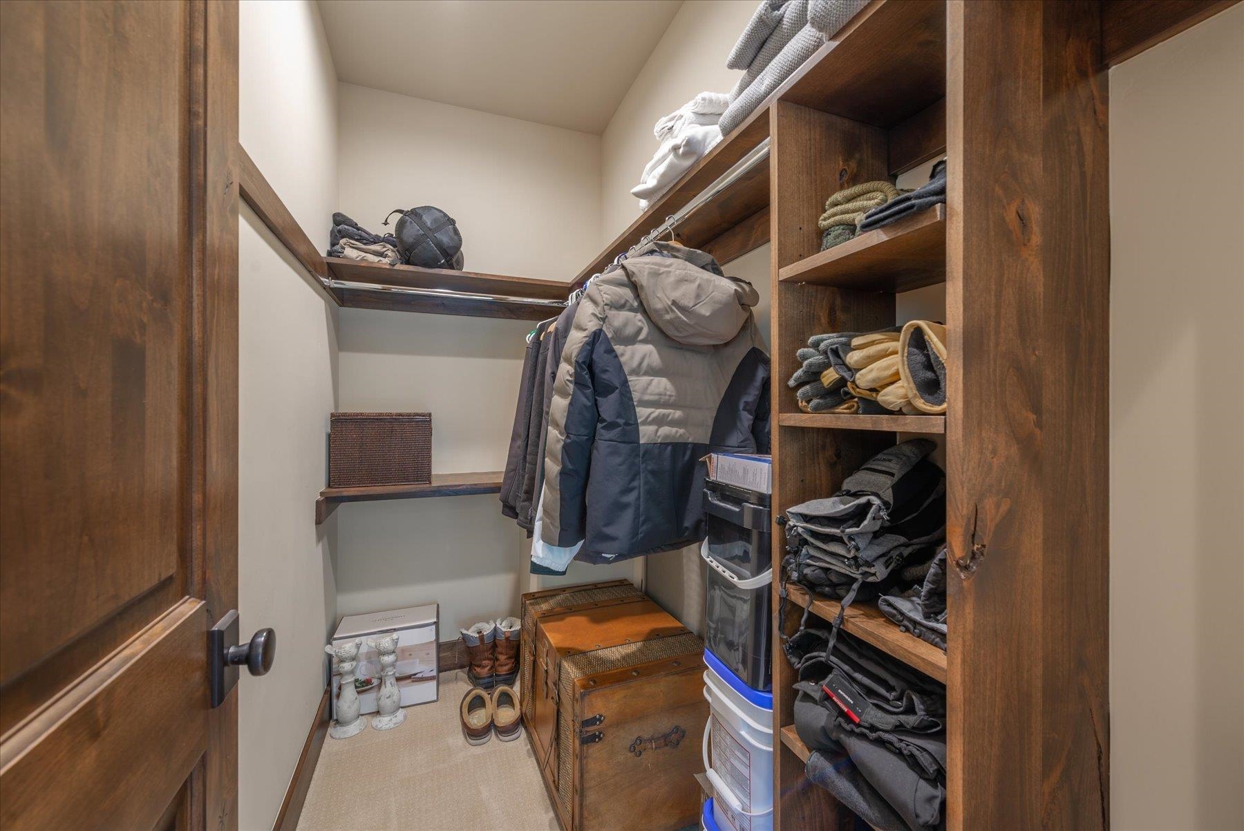 14475 Alder Creek Road Truckee, CA 96161 - Photo 15 of 21 a view of walk in closet with clothes and shoes