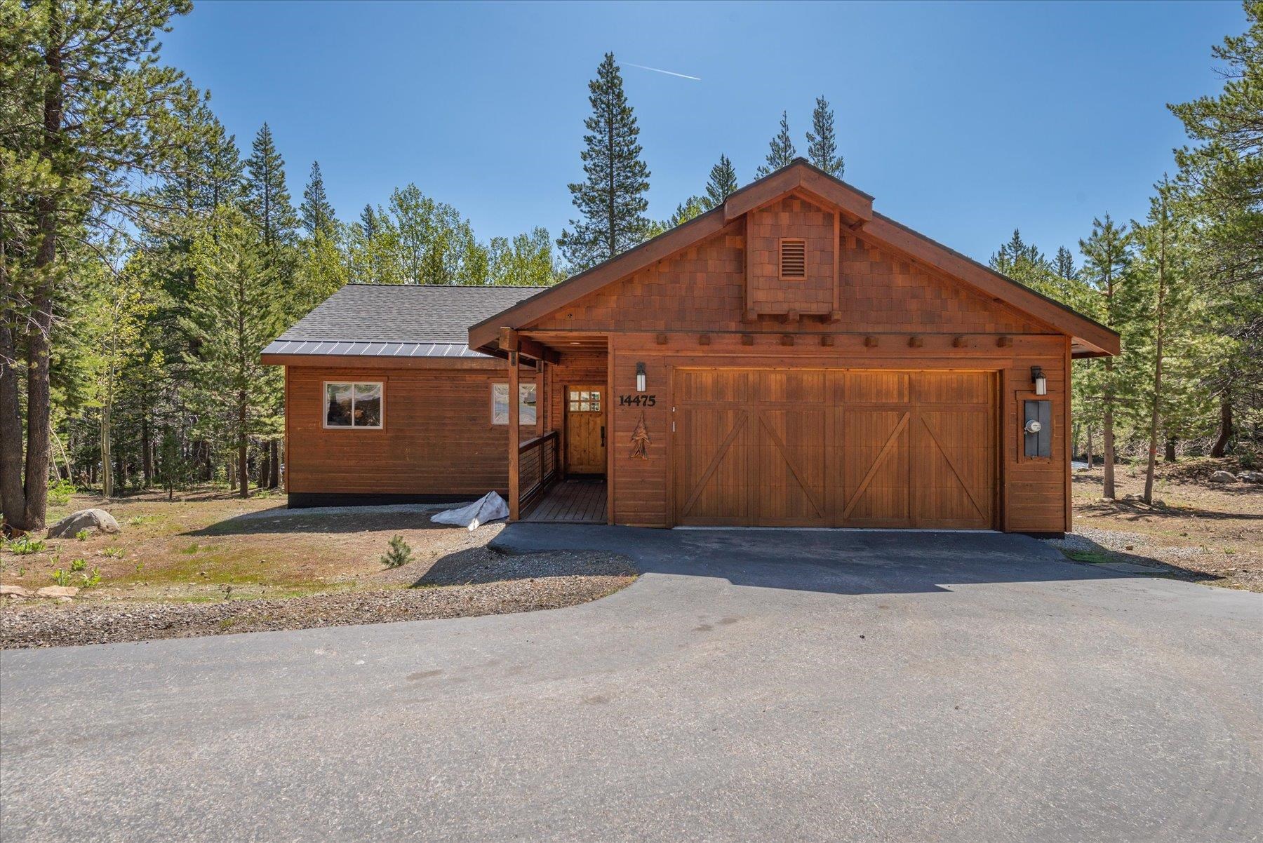 14475 Alder Creek Road Truckee, CA 96161 - Photo 2 of 21 a front view of a house with a yard and garage