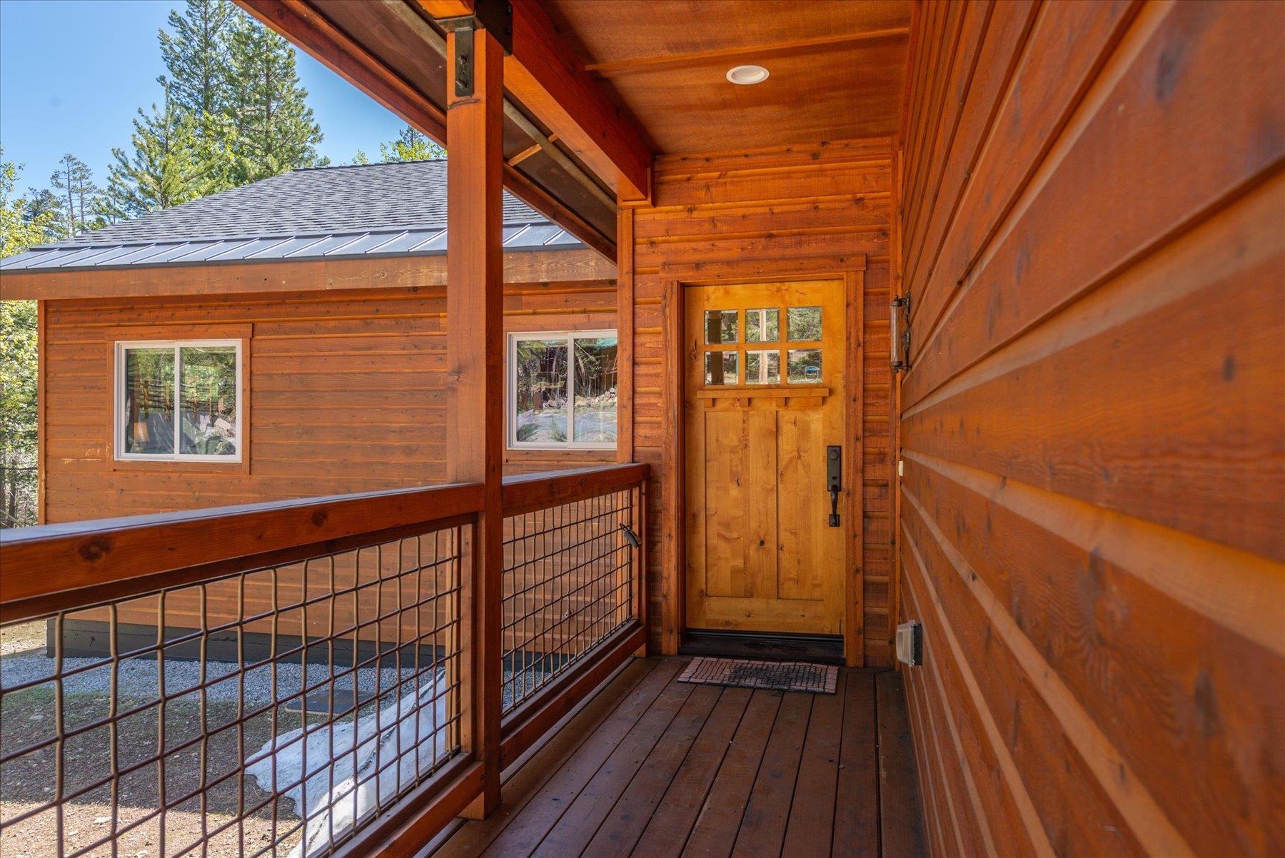 14475 Alder Creek Road Truckee, CA 96161 - Photo 4 of 21 a view of a balcony with wooden floor and fence