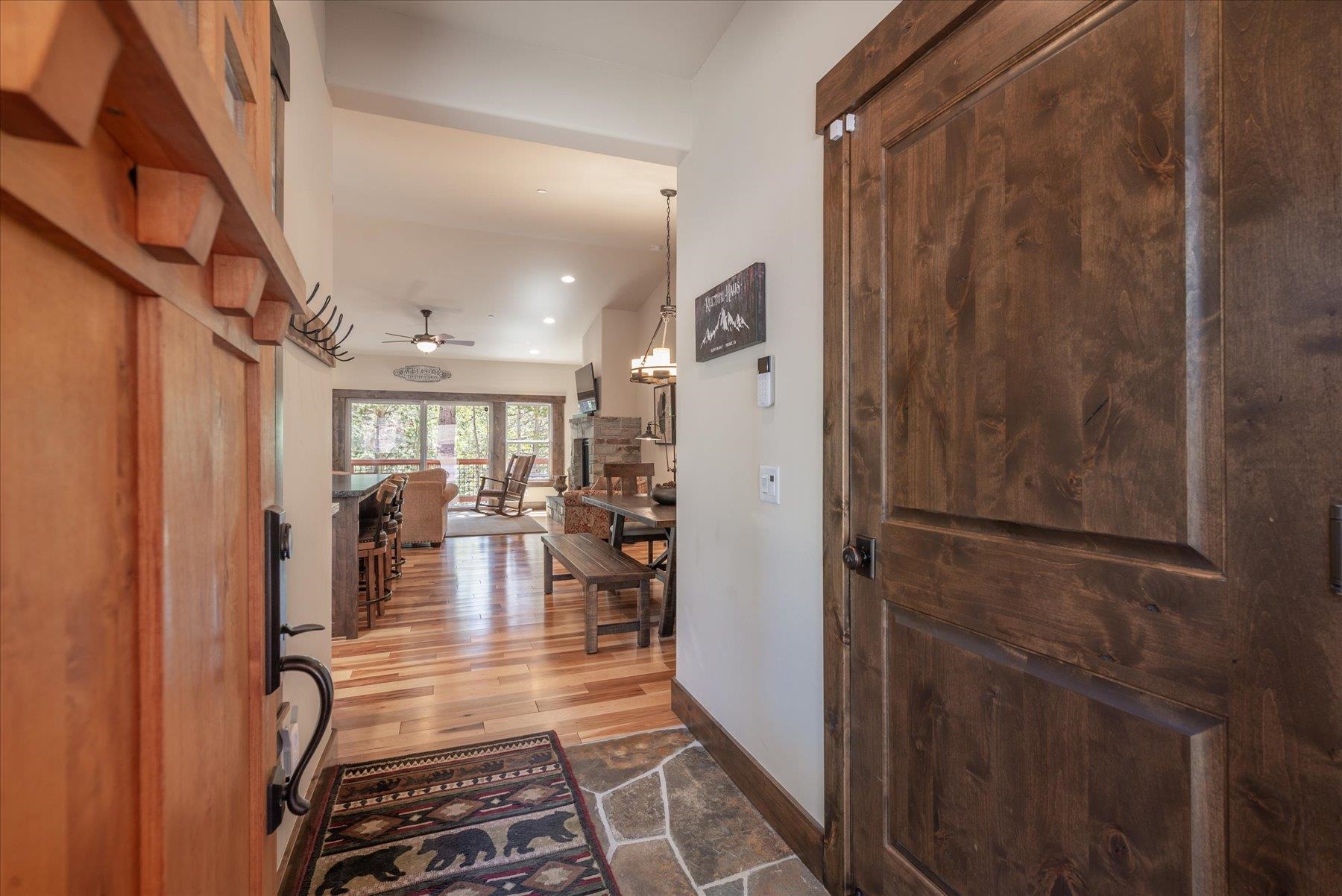 14475 Alder Creek Road Truckee, CA 96161 - Photo 5 of 21 a view of a hallway with living room and furniture