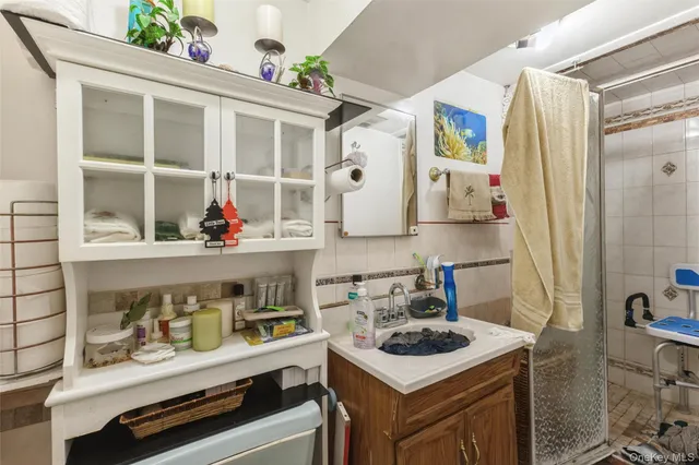 a kitchen with stainless steel appliances a stove a sink and a refrigerator
