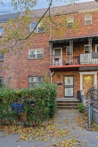 a view of a brick building with large windows