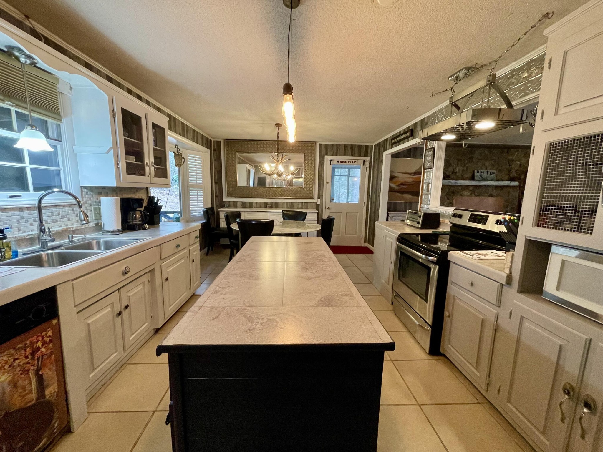 1522 Turkey Creek Road Tellico Plains, TN 37385 - Photo 25 of 34 a kitchen with sink stove and refrigerator