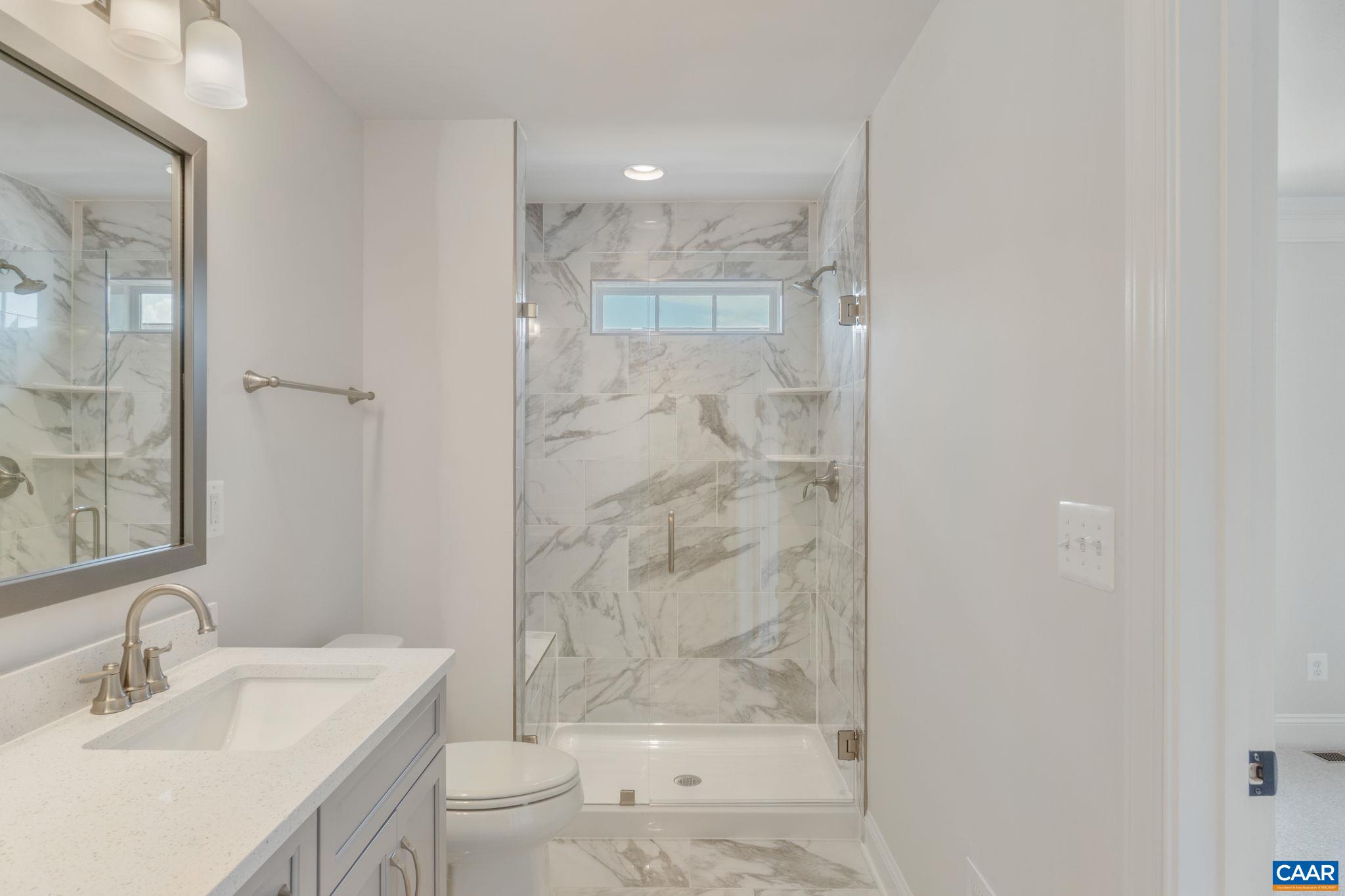 797 Park Ridge Drive Crozet, VA 22932 - Photo 27 of 43 a bathroom with a granite countertop sink a toilet and shower