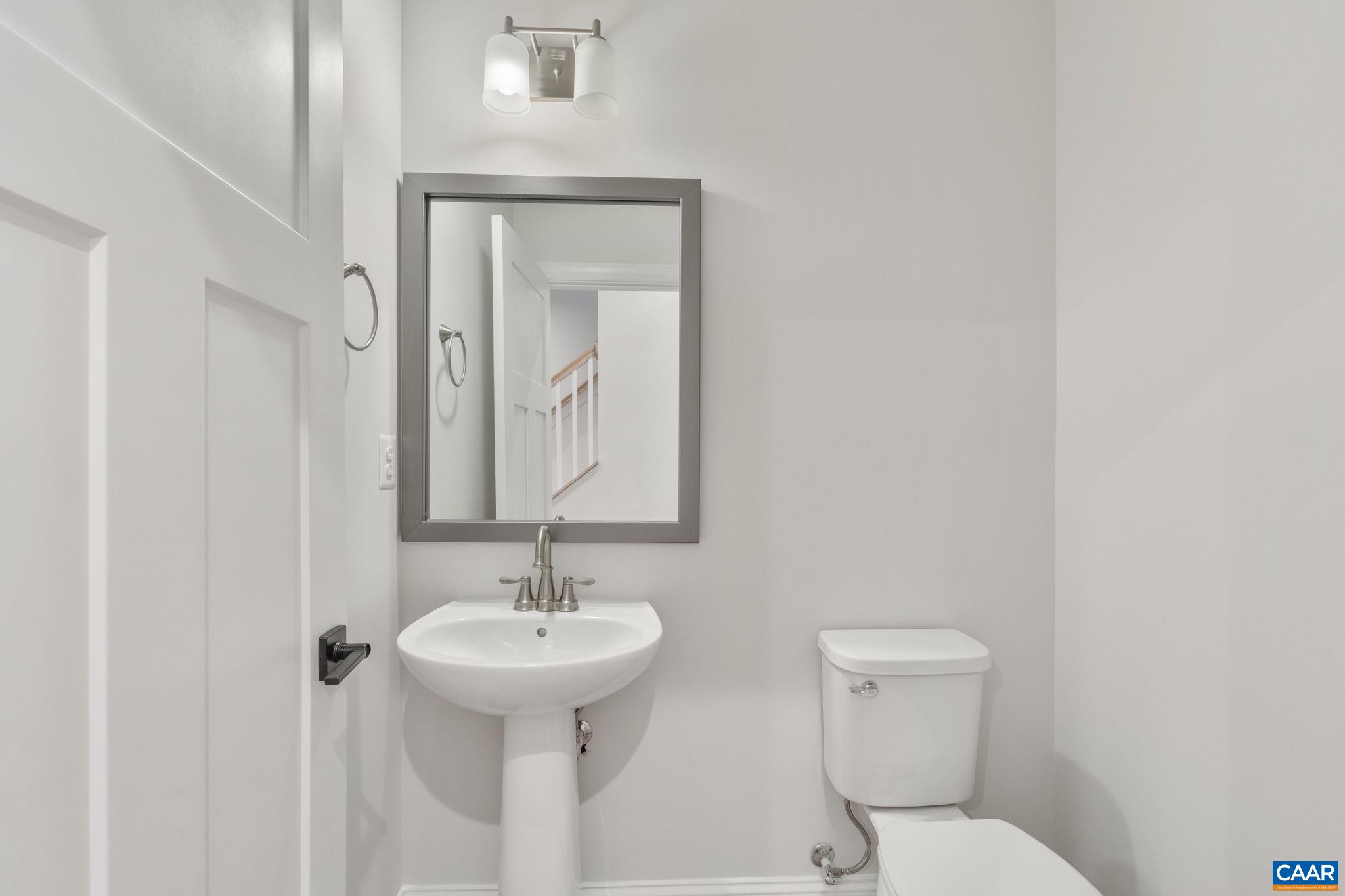 797 Park Ridge Drive Crozet, VA 22932 - Photo 37 of 43 a bathroom with a toilet sink and mirror