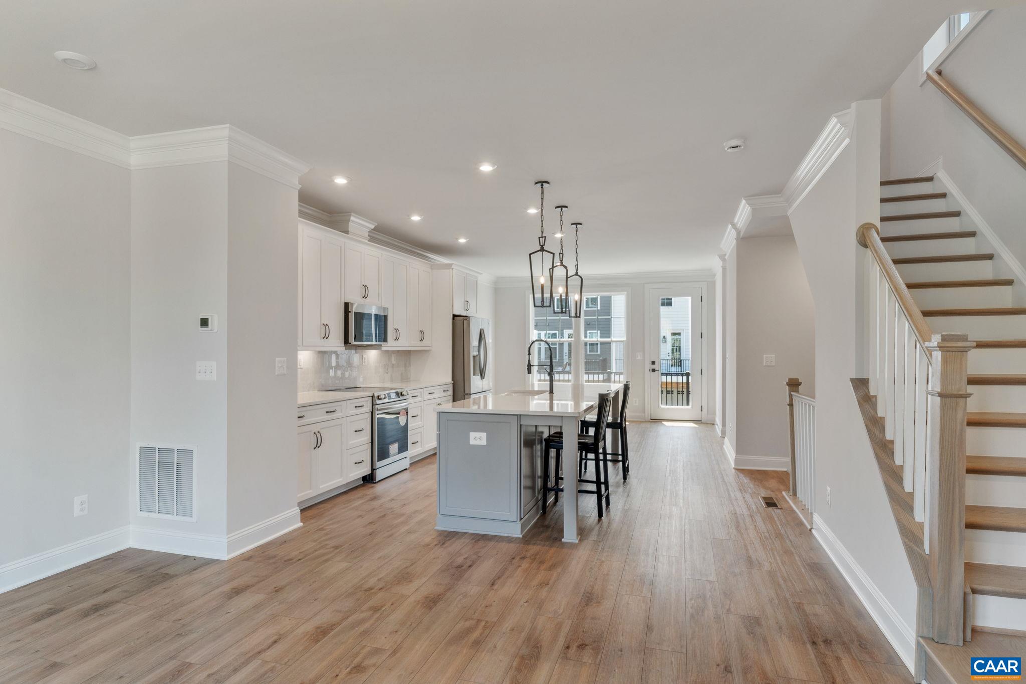 797 Park Ridge Drive Crozet, VA 22932 - Photo 7 of 43 a view of a dining room with furniture and wooden floor