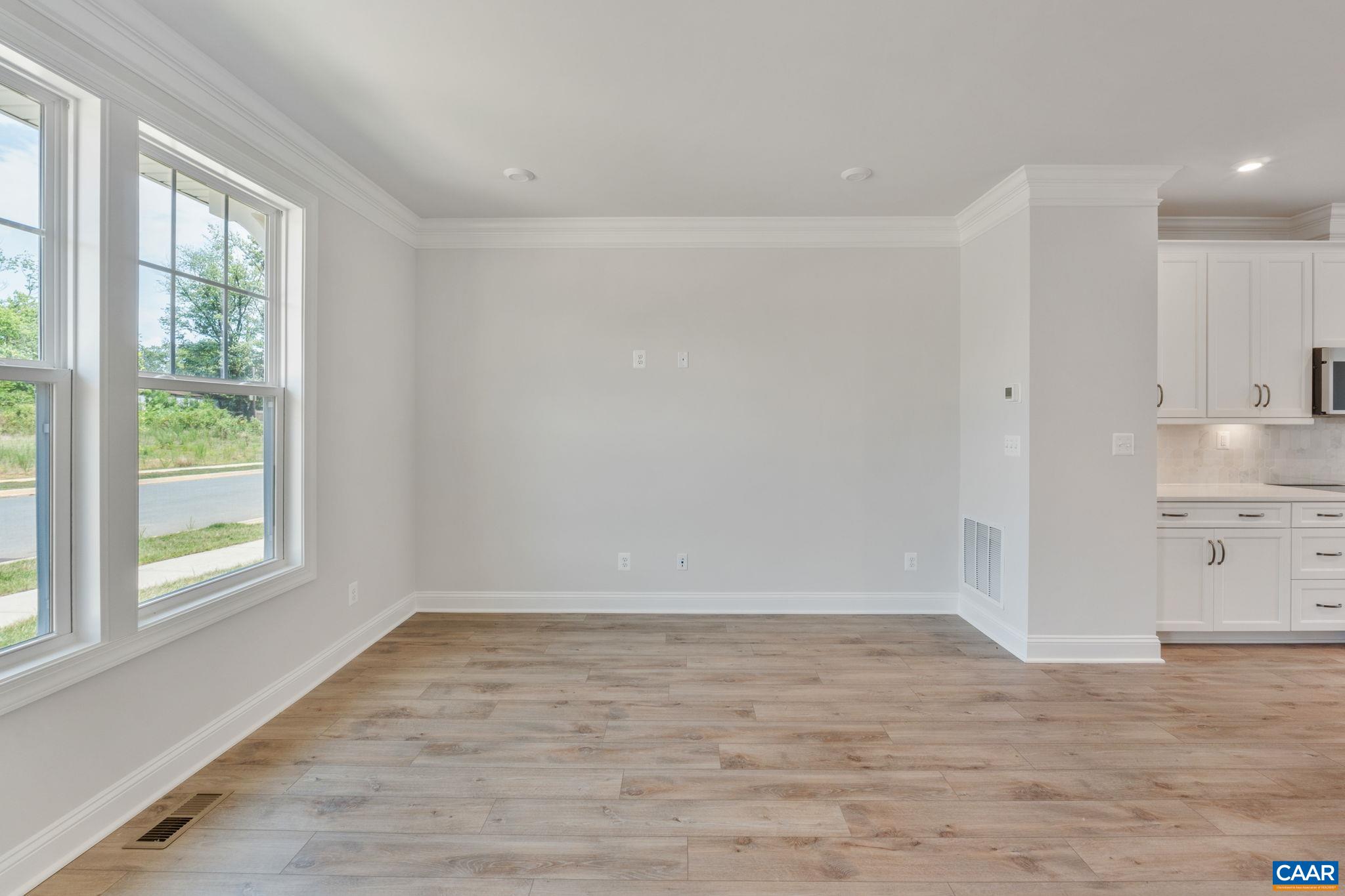 797 Park Ridge Drive Crozet, VA 22932 - Photo 8 of 43 a view of a kitchen with wooden floor and a window