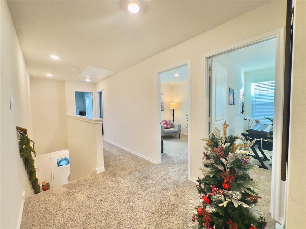 6000 Holly Spg Road Princeton, TX 75407 - Photo 19 of 27 a view of a hallway and a livingroom with furniture