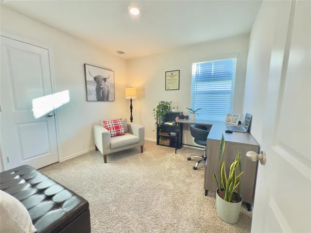 a bedroom with a bed and a couch