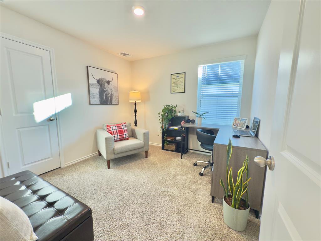 6000 Holly Spg Road Princeton, TX 75407 - Photo 20 of 27 a bedroom with a bed and a couch