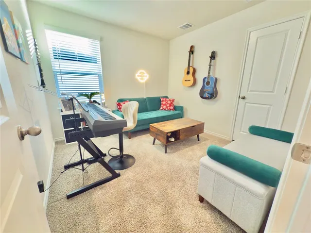 a living room with patio furniture