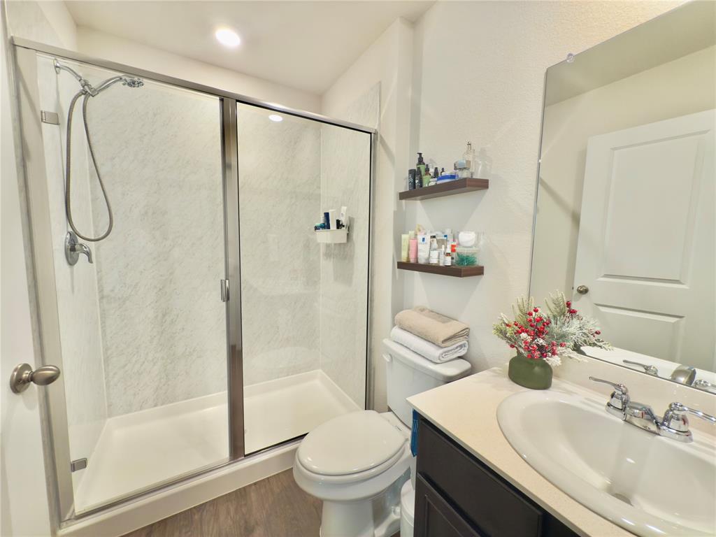 6000 Holly Spg Road Princeton, TX 75407 - Photo 23 of 27 a bathroom with a sink toilet and shower